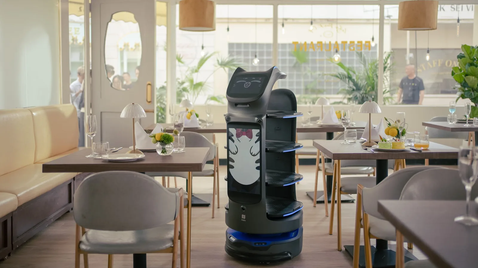 BellaBot Pro delivering in a hotel restaurant
